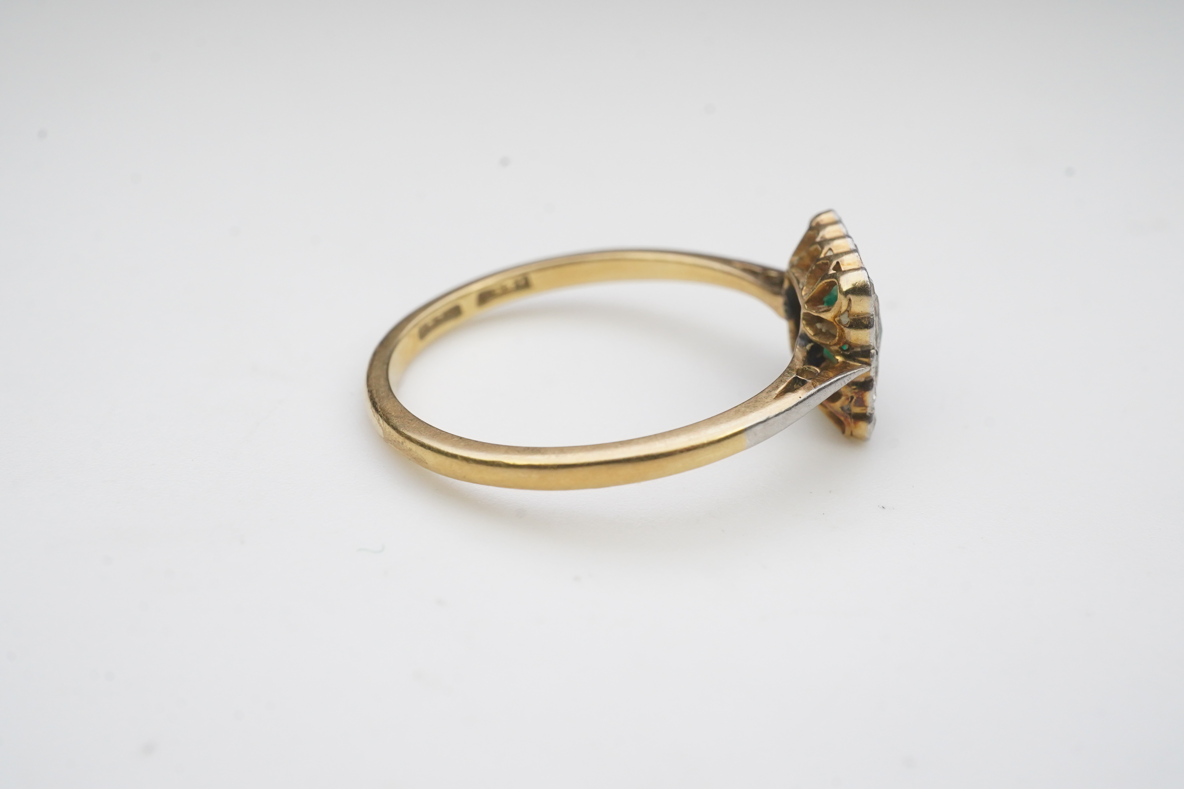 An emerald and diamond ring, early 20th century